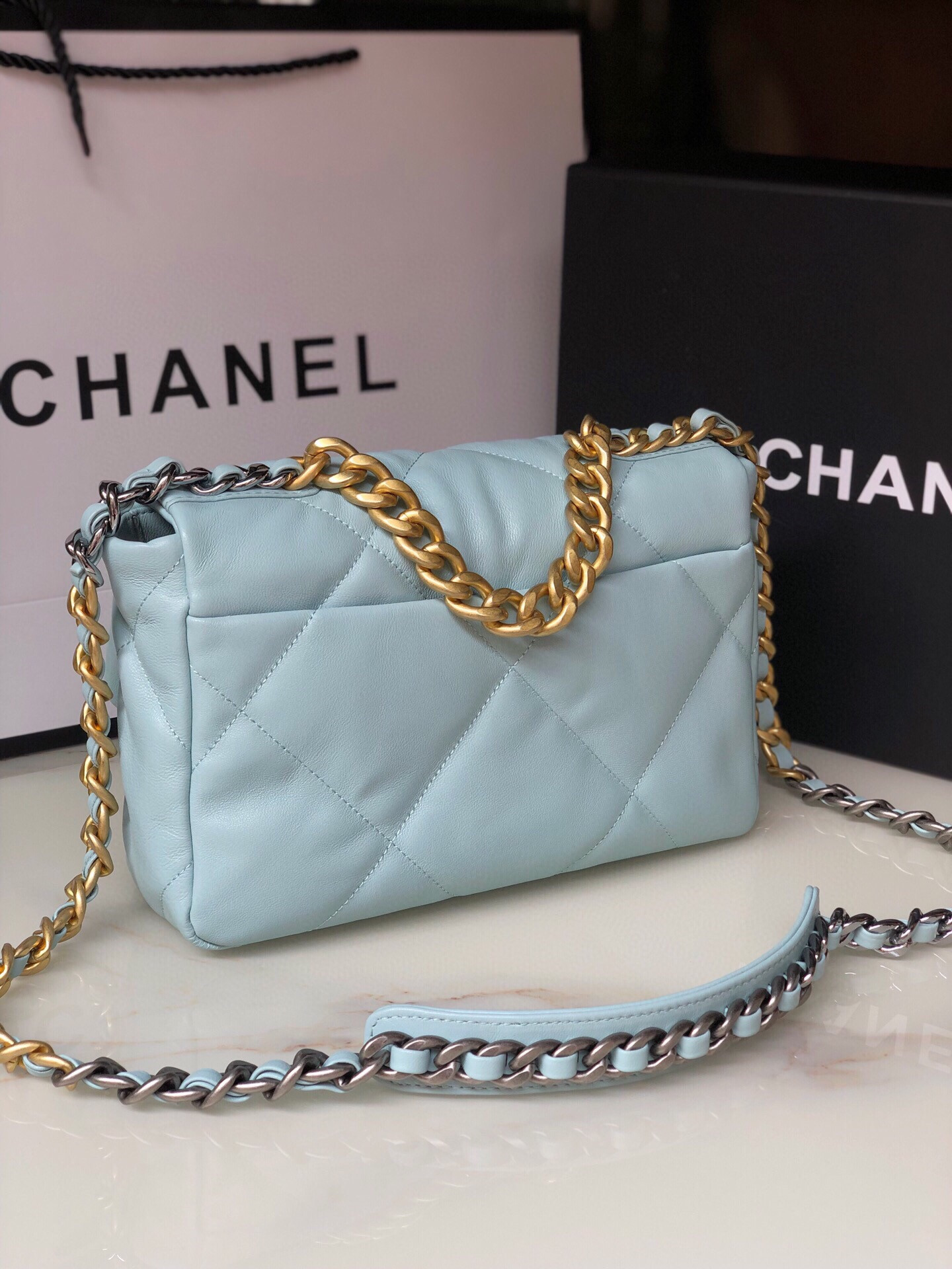 Ch*el 19 handbag shiny leather, gold-tone, silver-tone & ruthenium-finish metal light blue 6.2 × 10.1 × 3.5 in